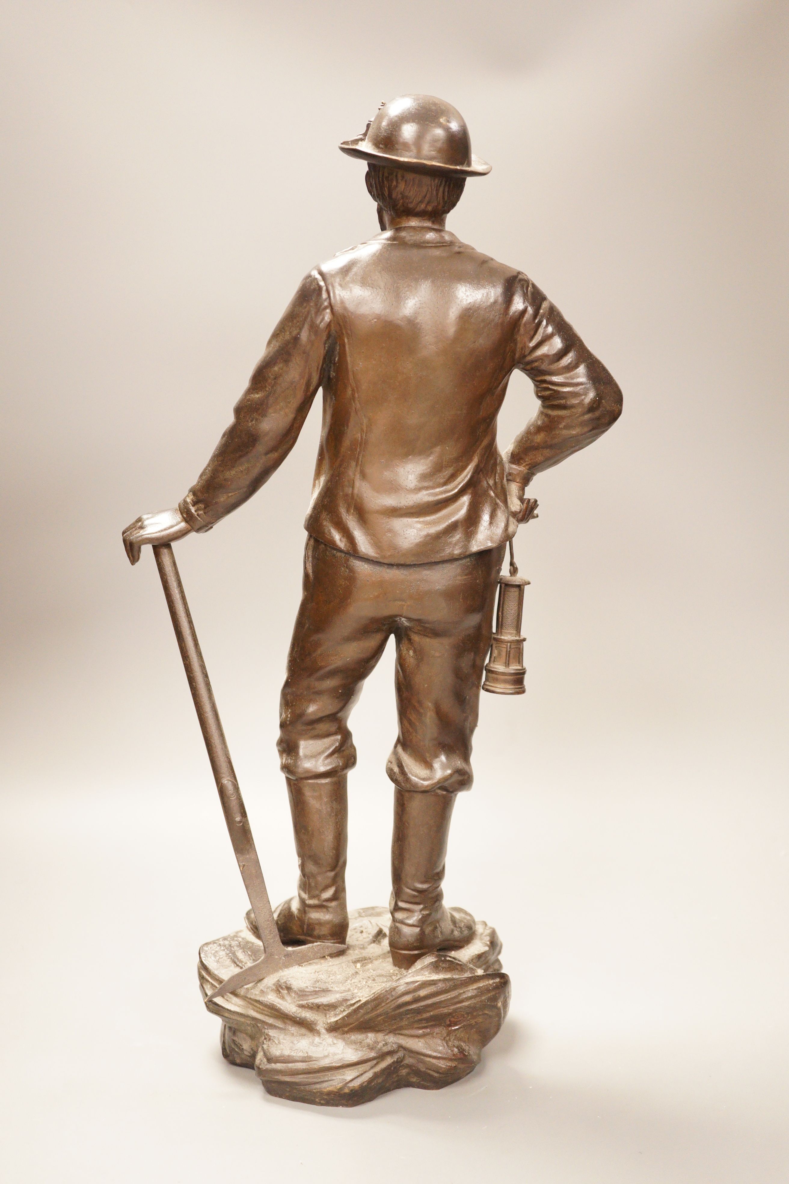 A French bronze figure, 'Dans la mine, par N. Telriv', 48cm